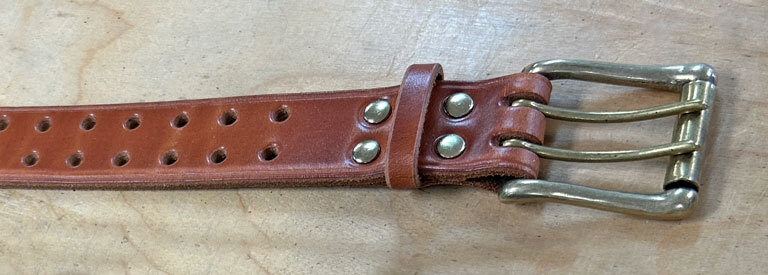 Solid brass double tongue roller buckle. Two prong buckle on a full grain leather belt.