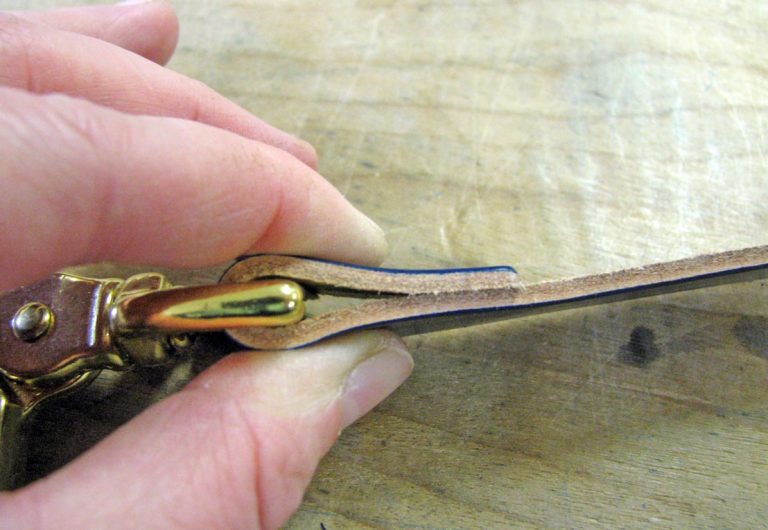 Fold the leather key chain strap over your scissor snap