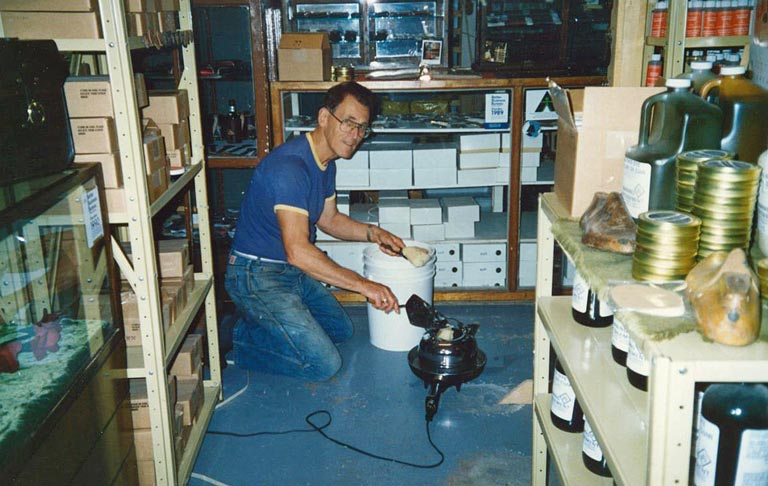 Leather care products being canned and bottled.