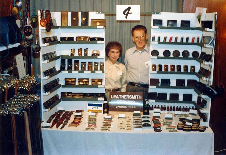 Leather goods displayed at craft show.