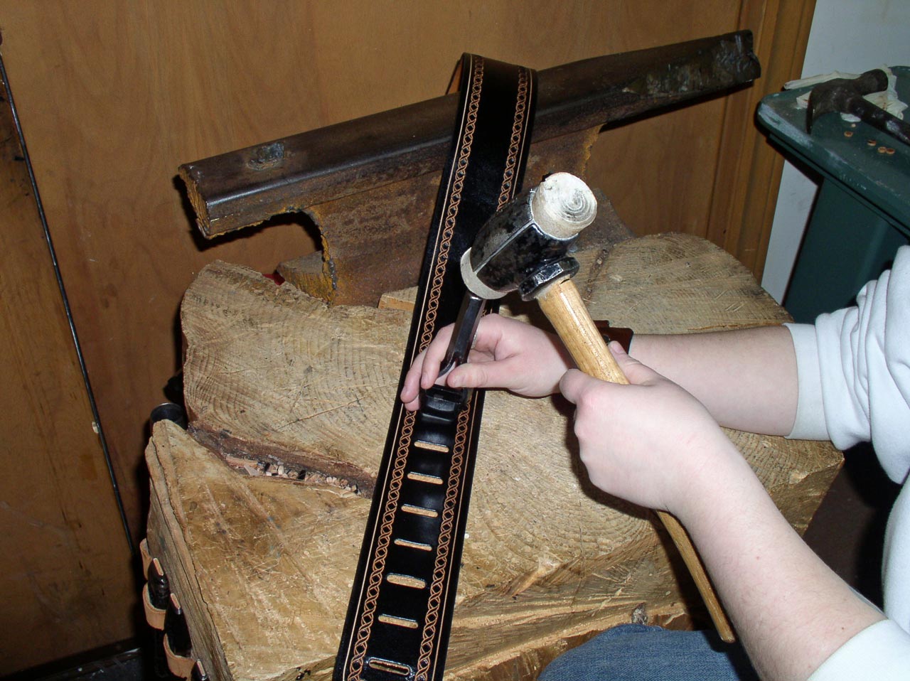 Punching oblong holes for making customized guitar straps