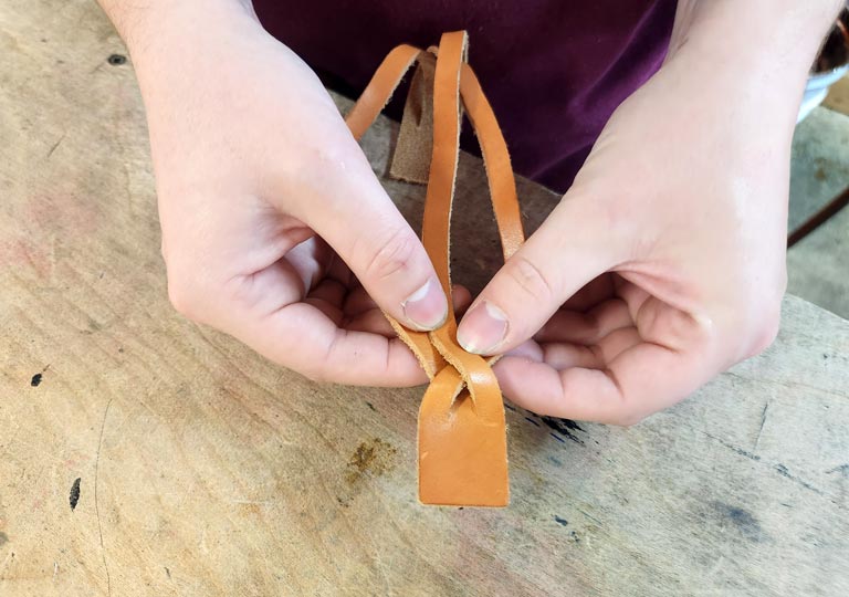 Fourth step in weaving the magic braid bracelet.