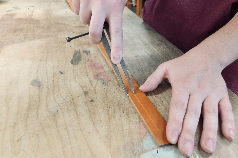 Marking strands in leather wristband.