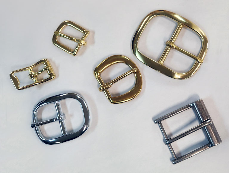 Belt buckle and strap buckle finishes. Variety of finishes on belt buckles and strap buckles.